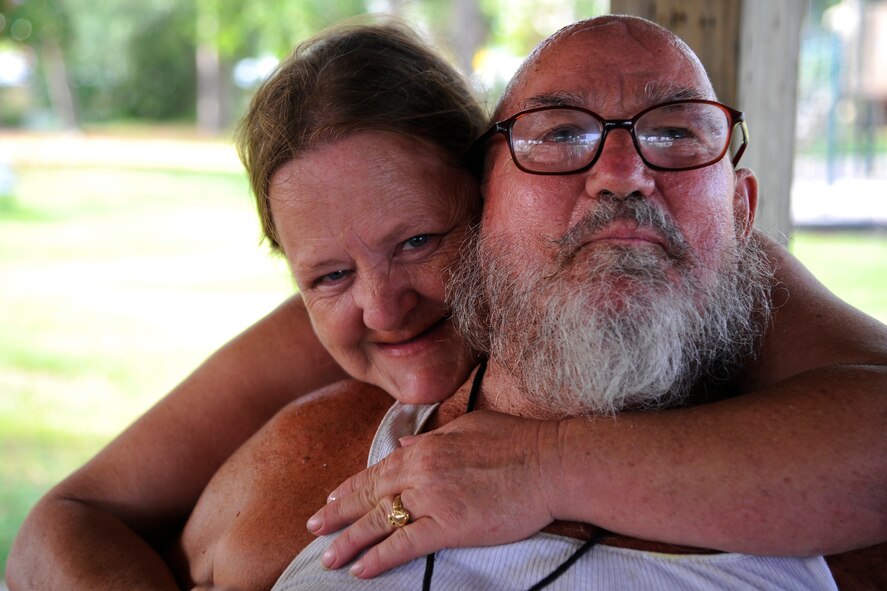 Debby and Robert DeLong embrace for a photo during a fundraiser event at Liza Jackson Park in Fort Walton Beach, Fla., Aug. 30, 2014. Robert served in the United States Army for 18 months and was discharged due to injuries he suffered during the Vietnam War. (U.S. Air Force photo/ Staff Sgt. Sarah Hanson) 