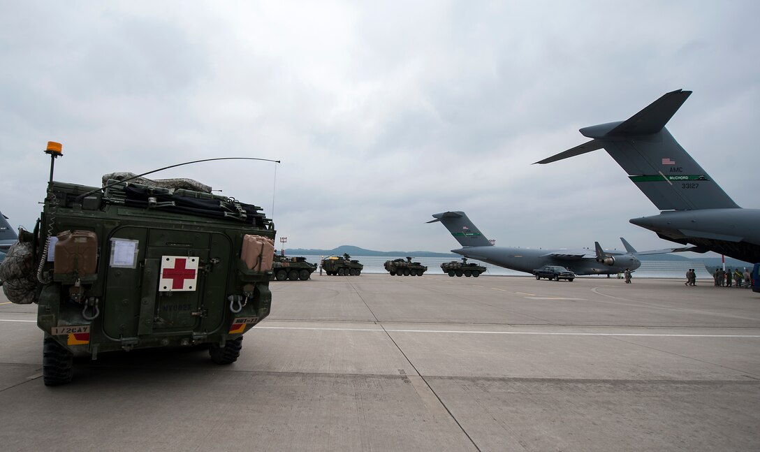 2nd Cavalry Regiment Strykers prepare to load into C-17 Globemaster IIIs in support of Steadfast Javelin II Sept. 4, 2014, at Ramstein Air Base, Germany. Steadfast Javelin II is a NATO exercise involving more than 2,000 troops and takes place across Estonia, Germany, Latvia, Lithuania and Poland. The exercise focused on increasing interoperability and synchronizing complex operations between allied air and ground forces through airborne and air assault missions. (U.S. Air Force photo/Senior Airman Damon Kasberg)