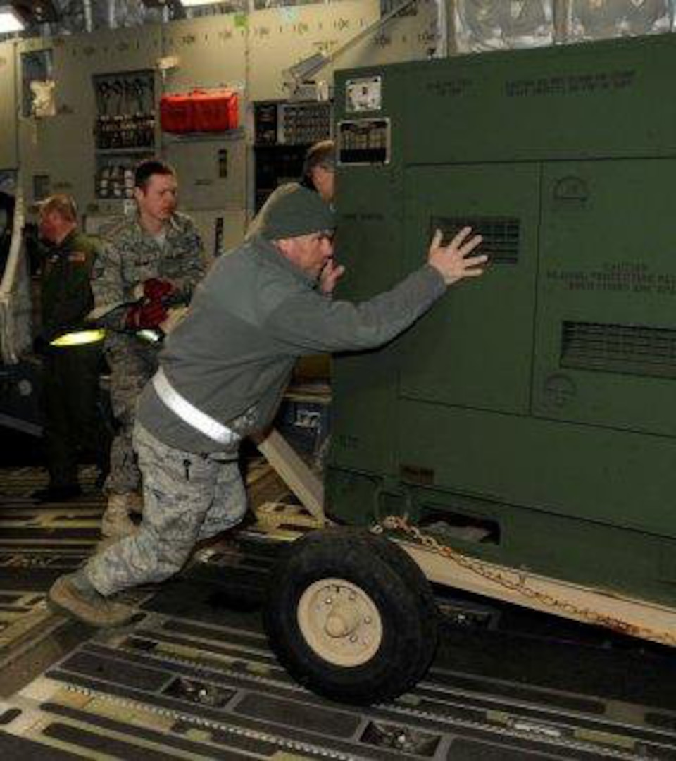 Airmen with the 188th Fighter Wing of the Arkansas Air National Guard load billets onto a C-17 Jan. 25. The billets are part of the unit's Disaster Relief Beddown Set (DRBS). The 188th was tasked with deploying its DRBS in support of Operation Unified Response.