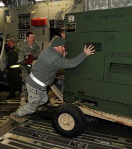 Airmen with the 188th Fighter Wing of the Arkansas Air National Guard load billets onto a C-17 Jan. 25. The billets are part of the unit's Disaster Relief Beddown Set (DRBS). The 188th was tasked with deploying its DRBS in support of Operation Unified Response.