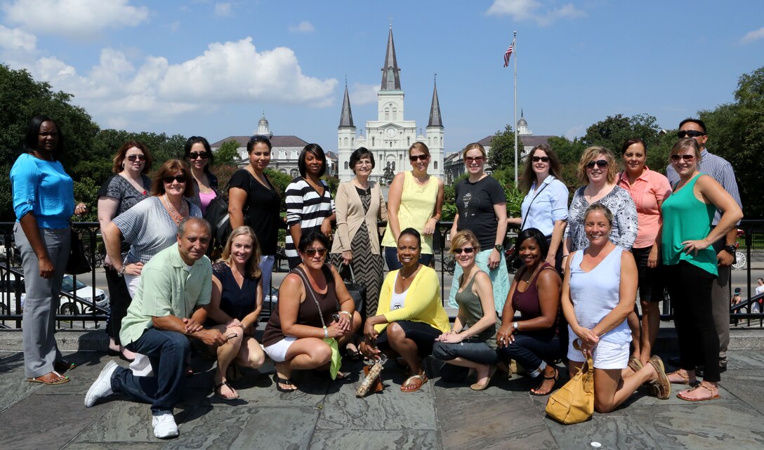 The spouses and family readiness officers of 4th Marine Logistics Group pose for a picture in downtown New Orleans after attending the Commander’s Conference at the Marine Corps Support Facility, New Orleans, Sep. 6-7, 2014. The spouses and Marines attended briefs given throughout the weekend focusing on the upcoming year for 4th MLG. The briefs provided information on the upcoming training for the year and how spouses can be involved and help with family readiness. 