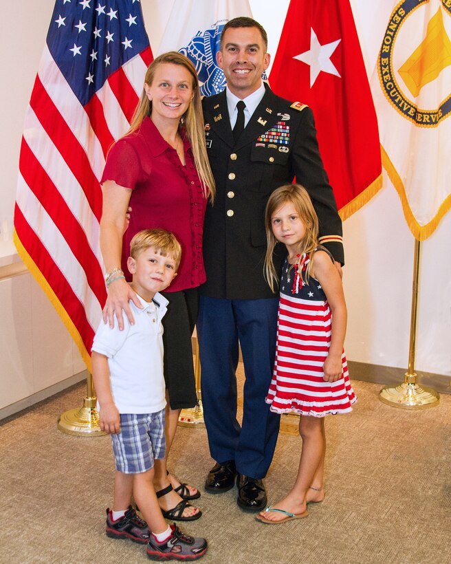 SAN FRANCISCO - (Sept. 24, 2014) - U.S. Army Corps of Engineers San Francisco District Deputy Commander Maj. (P) Adam J. Czekanski is pictured with his wife, Wendi, daughter Annabelle and son Nicholas today after receiving the Soldier's Medal for his actions of valor and heroism earlier this year when he jumped onto the tracks as a commuter train was approaching to save a fellow rider who had fallen due to an apparent seizure.  Czekanski credited his years of military training as he quickly assessed the situation and jumped into action to save a stranger while placing himself in imminent danger. 