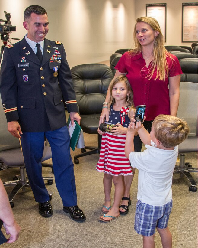 SAN FRANCISCO - (Sept. 4, 2014) - U.S. Army Corps of Engineers San Francisco District Deputy Commander Maj. (P) Adam J. Czekanski received the Soldier's Medal today for his actions of valor and heroism earlier this year when he jumped onto the tracks as a commuter train was approaching to save a fellow rider who had fallen due to an apparent seizure.  His son, Nicholas, shot a few photos of his hero father as Czekanski's wife, Wendi and daughter Annabelle look on.  The Soldier's Medal is the Army's highest award for valor in a non combat situation.  Czekanski, who has served three combat tours; two in Afghanistan and one in Iraq, has also received three Bronze Star medals one Purple Heart medal.  He credits his years of military training as he quickly assessed the situation and jumped into action to save a stranger while placing himself in imminent danger.
