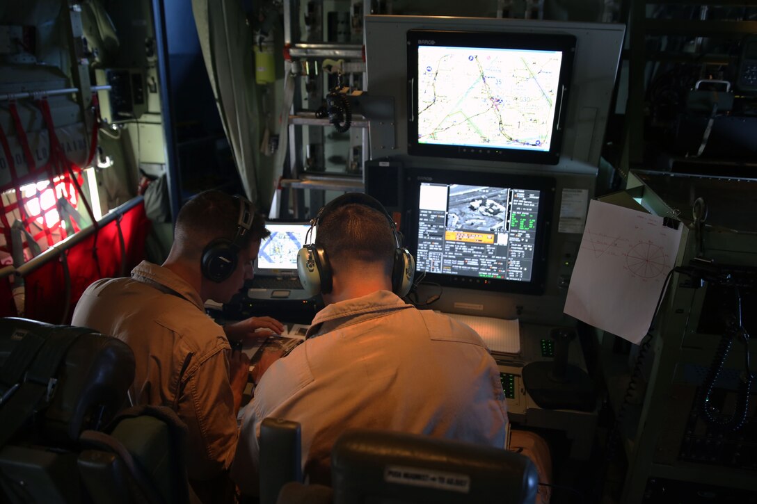 Capt. Mike Jordan, left, and Capt. Craig Fitzhugh operate the Harvest Hercules Airborne Weapons Kit system in a modified KC-130J Super Hercules at Marine Corps Air Station Cherry Point, N.C., Sept. 2, 2014. The Harvest HAWK comes equipped with both Hellfire and Griffin missiles to provide close-air support for Marines on the ground. Jordan and Fitzhugh are both KC-130J pilots with Marine Aerial Refueler Transport Squadron 252.