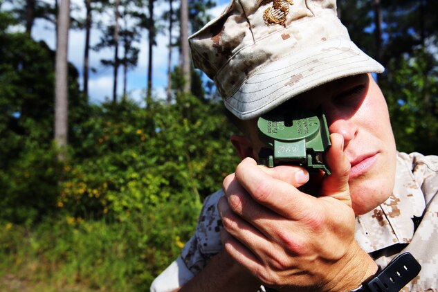 Lance Cpl. Justin Goodchild shoots an azimuth during land navigation training at Marine Corps Air Station Cherry Point, N.C., Sept. 3, 2014. Goodchild is part of the team leaders course with 2nd Low Altitude Air Defense Battalion, where a full day of instruction and practical application is dedicated to land navigation. Goodchild is a LAAD gunner with the battalion and is a native of Longwood, Fla.
