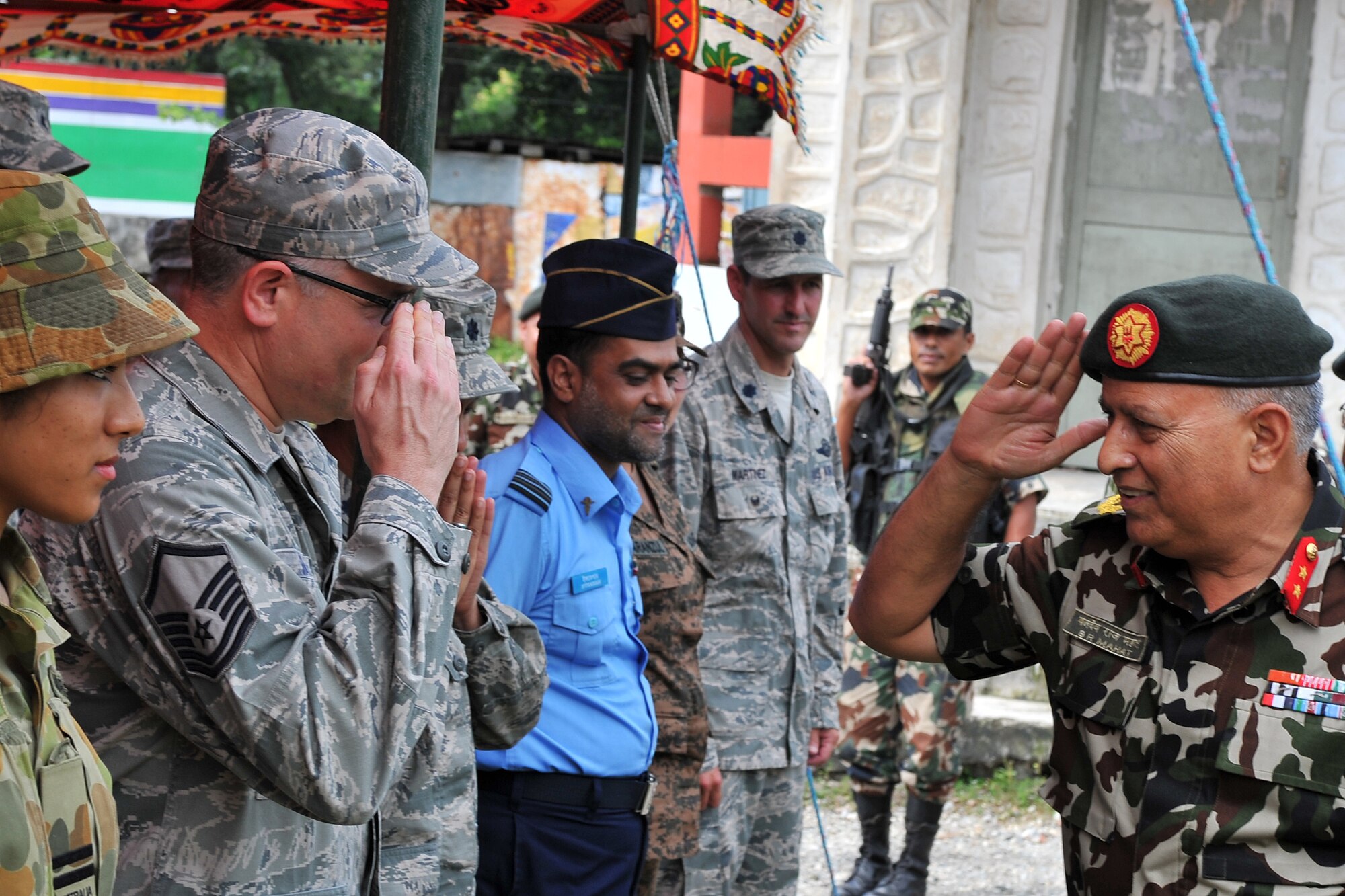 Nepalese Army Maj. Gen. Baldev Mahat greets Operation Pacific Angel-Nepal members during the opening ceremony in Manahari, Nepal, Sept. 8, 2014. PACANGEL supports U.S. Pacific Command’s capacity-building efforts by partnering with other governments, non-governmental agencies and multilateral militaries in the respective region to provide medical, dental, optometry and engineering assistance to their citizens. (U.S. Air Force photo by Staff Sgt. Melissa B. White/Released)