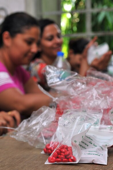 U.S. military members and local nursing students help sort multivitamins at a health services outreach site in Manahari, Nepal, Sept. 7, 2014, to prepare for Operation Pacific Angel-Nepal. PACANGEL supports U.S. Pacific Command’s capacity-building efforts by partnering with other governments, non-governmental agencies and multilateral militaries in the respective region to provide medical, dental, optometry and engineering assistance to their citizens. (U.S. Air Force photo by Staff Sgt. Melissa B. White/Released) 