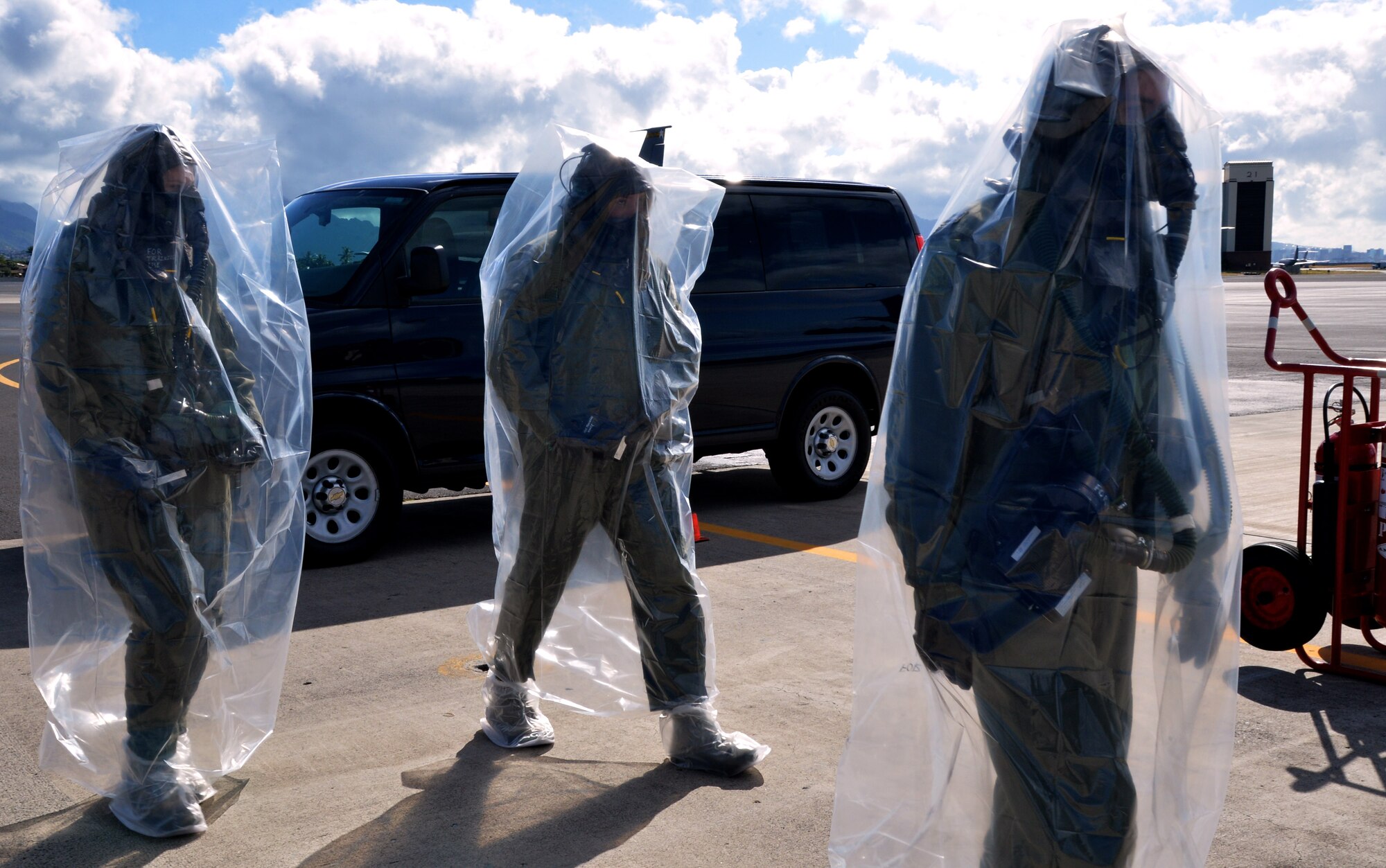Members of the 96th Air Refueling Squadron prepare to board a KC-135 Stratotanker during an emergency preparedness training event Sept. 5, 2014, at Joint Base Pearl Harbor-Hickam, Hawaii. The 96th ARS members participated in the chemical, biological, radiological and nuclear training that ensures they are prepared to operate in a contaminated environment. (U.S. Air Force photo by Staff Sgt. Alexander Martinez)
