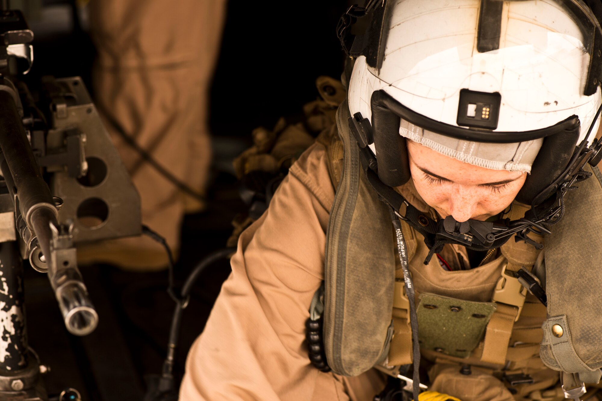 A crew member inspects equipment aboard a MV-22B Osprey Sept. 8, 2014, at Saylor Creek Range Complex, Idaho. The crew members are based out of the Medium Titroter Squadron 161, 3rd Marine Aircraft Wing at Mirimar, Calif. (U.S. Air Force photo by Airman 1st Class Malissa Lott/RELEASED)