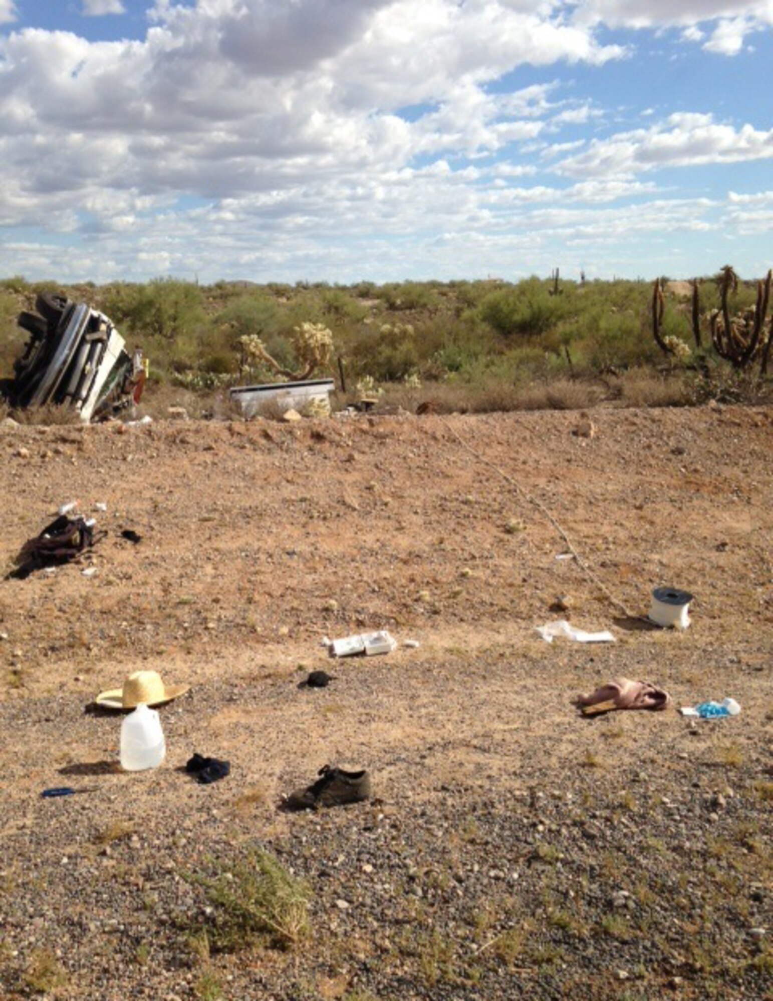 Debris is strewn alongside E Florence-Kelvin Hwy in the wake of an automobile accident Aug. 24, 2014. Three D-M Airmen used their Self Aid Buddy Care training to provide first aid to four victims. (Courtesy photo)