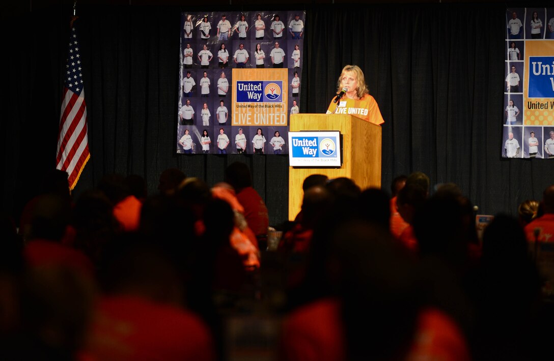 Renee Parker, United Way of the Black Hills executive director, thanks Airmen and community volunteers during the United Way Day of Caring kickoff luncheon in Rapid City, S.D., Sept. 4, 2014. The Day of Caring was established in 1992 to promote the spirit and value of volunteerism, increase the awareness of local human service agencies and schools and demonstrate what people working together for the community’s good can accomplish. (U.S. Air Force photo by Senior Airman Zachary Hada/Released)
