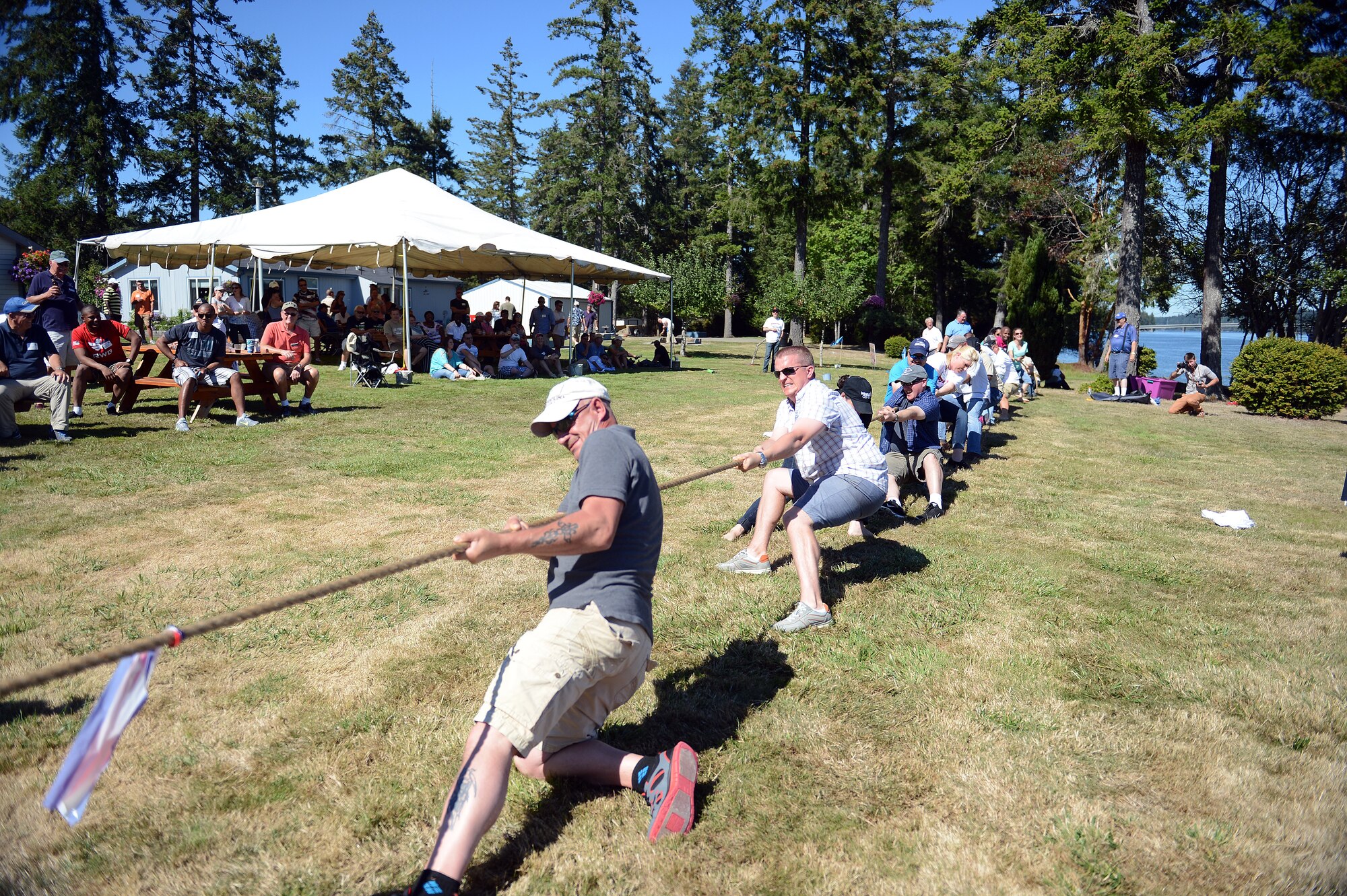 Service members from Joint Base Lewis-McChord and members of the Olympia Yacht Club participate in a game of tug-of-war Sept. 5, 2014, during Foofaraw at Island Home, Wash. Foofaraw is an annual event sponsored by the Olympia Yacht Club and local businesses to provide military service members a day of relaxation. (U.S. Air Force photo/Airman 1st Class Keoni Chavarria)