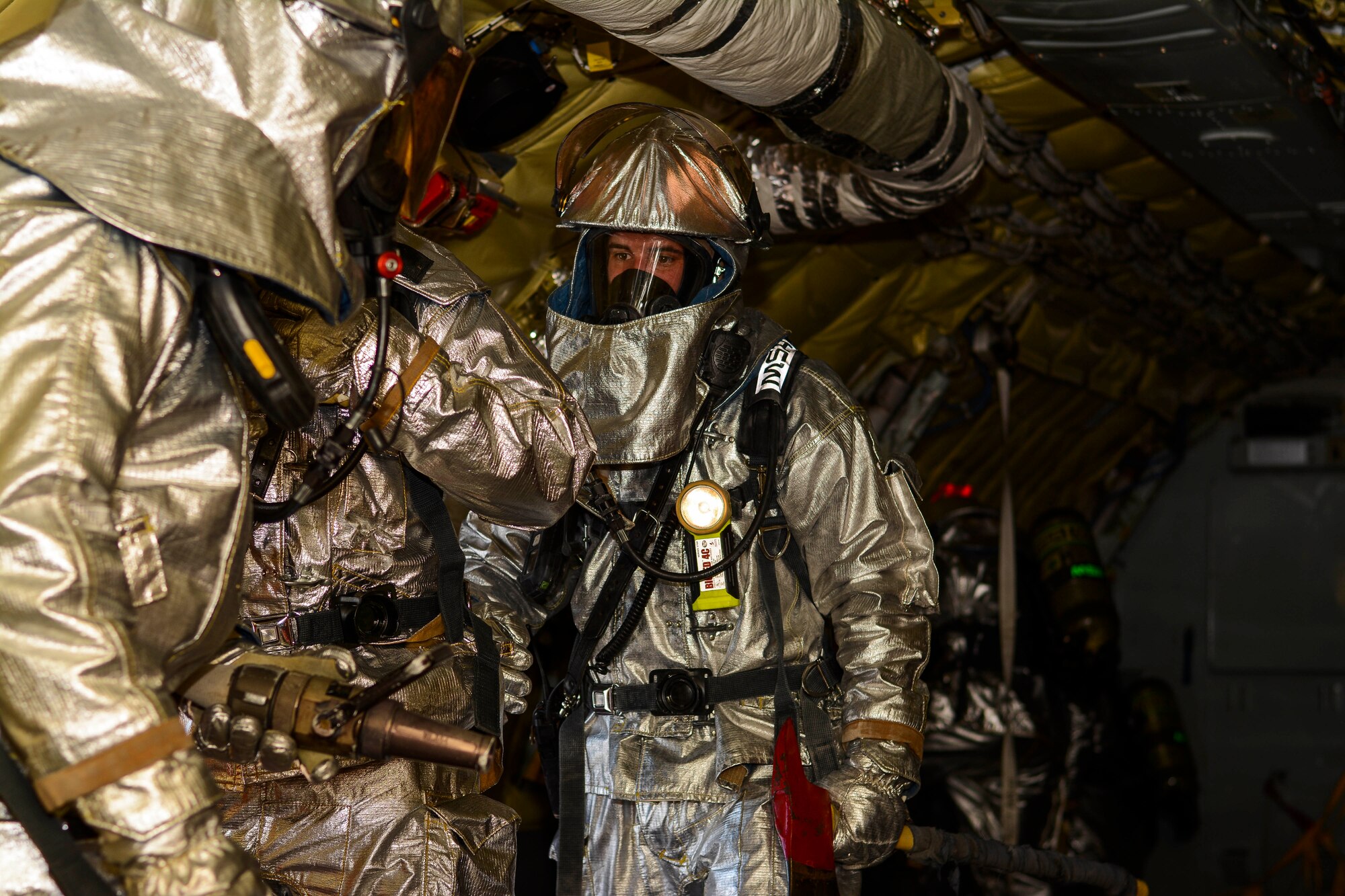 Firefighters from the 507th Air Refueling Wing Civil Engineer Squadron enter a simulated disabled KC-135R Stratotanker and search the rear of the aircraft for fires and victims.  The training was part of a quarterly super unit training assembly held by members of the CES in order to fulfill training requirements that cannot normally be done on a regular drill weekend.  (U.S. Air Force photo/Senior Airman Mark Hybers)