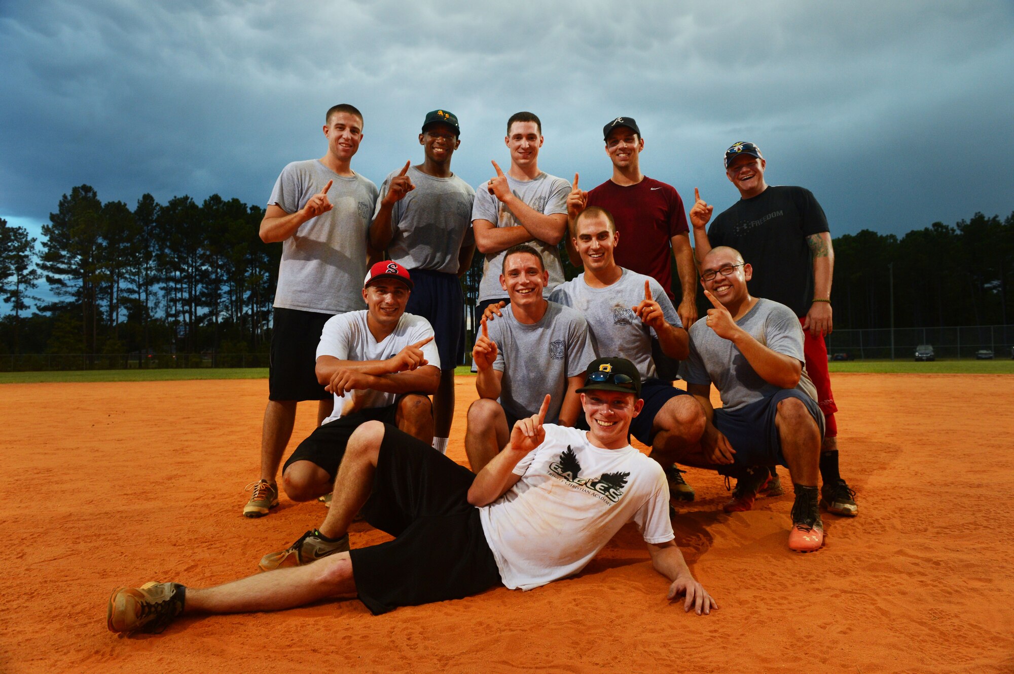 Members of the 20th Civil Engineer Squadron Fire Department softball team pose for a photo after winning the intramural softball championship at Shaw Air Force Base, S.C., Sept. 2, 2014. The 20th CES Fire Department defeated the 20th Aircraft Maintenance Squadron 5-4. (U.S. Air Force photo by Airman 1st Class Jensen Stidham/Released)