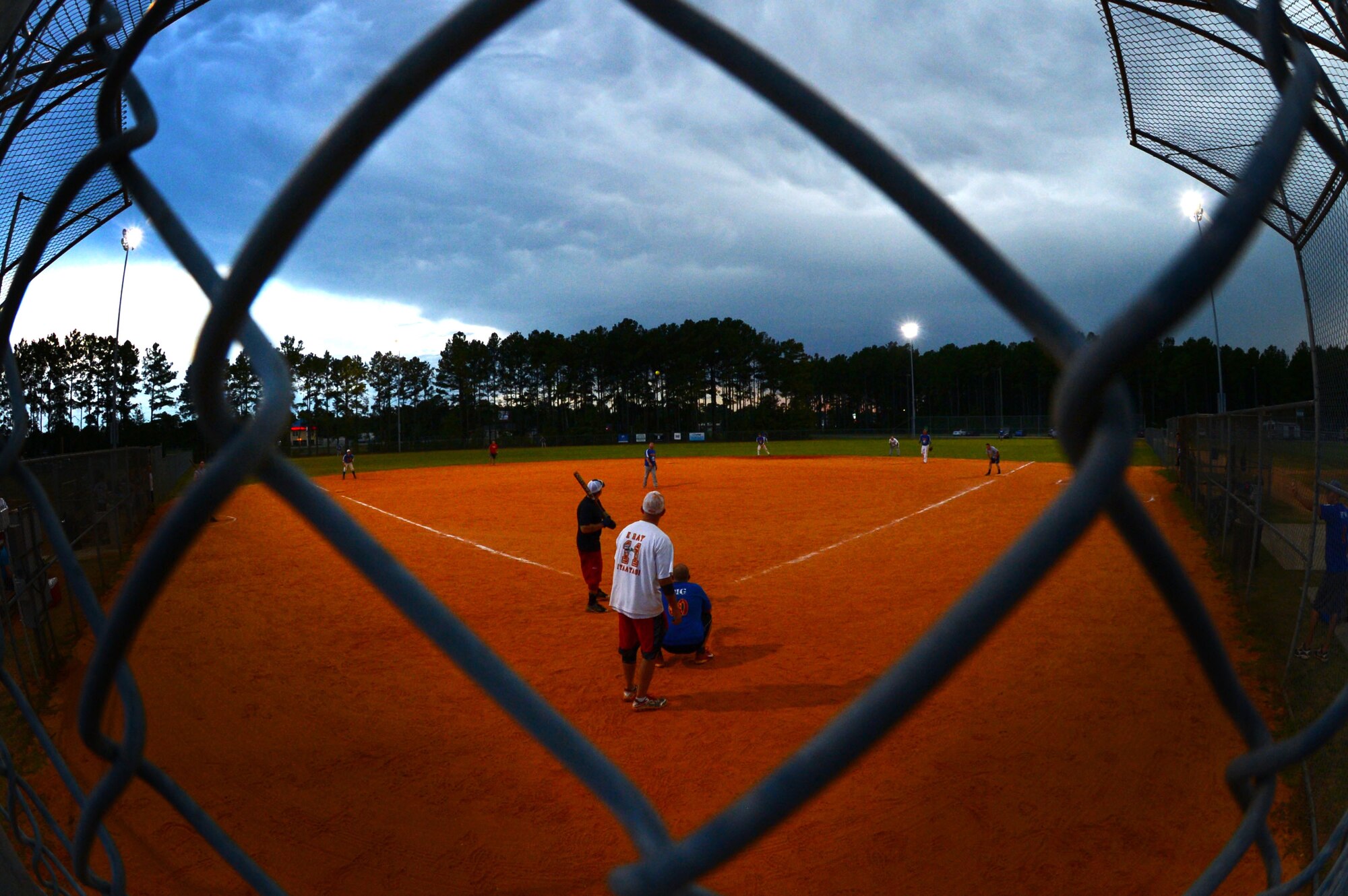 The 20th Civil Engineer Squadron Fire Department competes against the 20th Aircraft Maintenance Squadron in the intramural softball championship at Shaw Air Force Base, S.C., Sept. 2, 2014. The 20th AMXS made it to the championship game after previously beating the 20th Equipment Maintenance Squadron munitions flight team. (U.S. Air Force photo by Airman 1st Class Jensen Stidham/Released)
