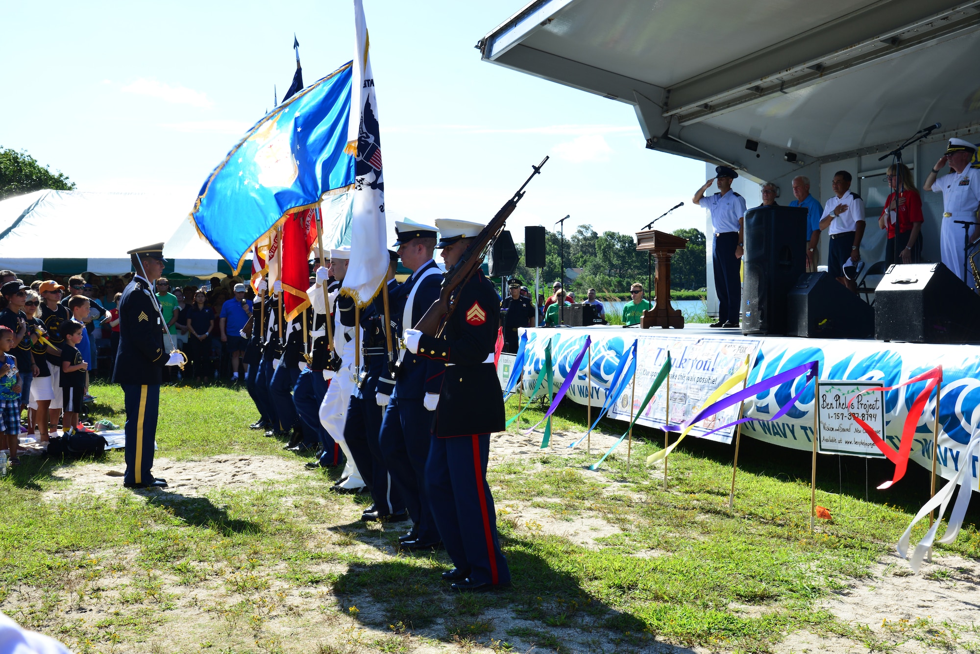 The U.S. Joint Service Color Guard presents the colors during the Out of the Darkness community walk in Virginia Beach, Va., Sept. 6, 2014. Hampton Roads community and military members came together to support the notion of depression as a treatable disease and suicide as a preventable tragedy. (U.S. Air Force photo by Senior Airman Aubrey White/Released)