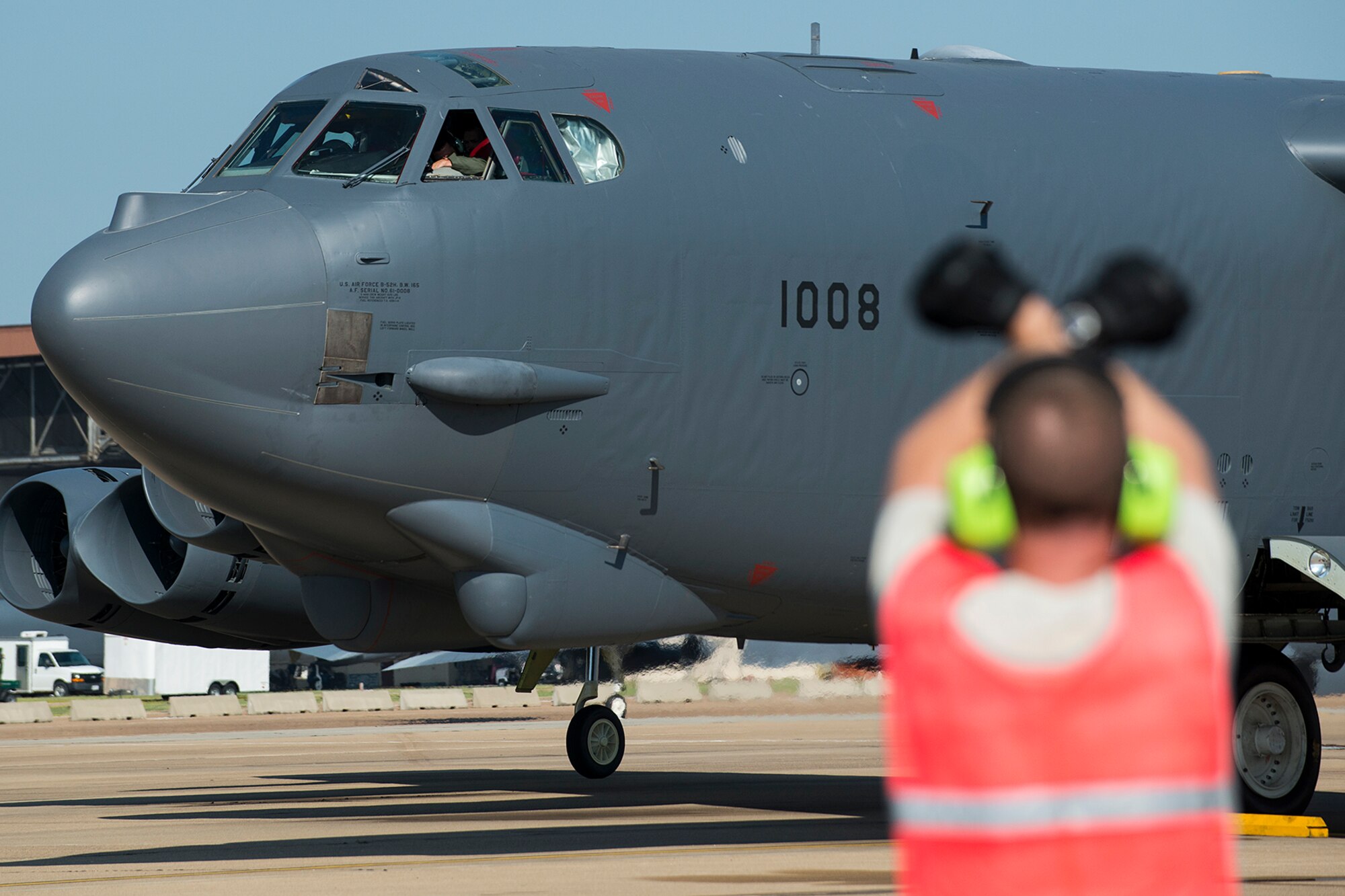U.S. Air Force Tech. Sgt. Bryan Fields, 2nd Aircraft Maintenance Squadron crew chief, directs the aircrew of a 307th Bomb Wing B-52H Stratofortress to apply the brakes prior to leaving for a mission on Aug. 28, 2014, Barksdale Air Force Base, La. On board the aircraft is Col. William Lyons, Assistant Vice Commander and the Director of Staff for 10th Air Force, who visited the 307th BW and flew his first flight in a B-52. (U.S. Air Force photo by Master Sgt. Greg Steele/Released)