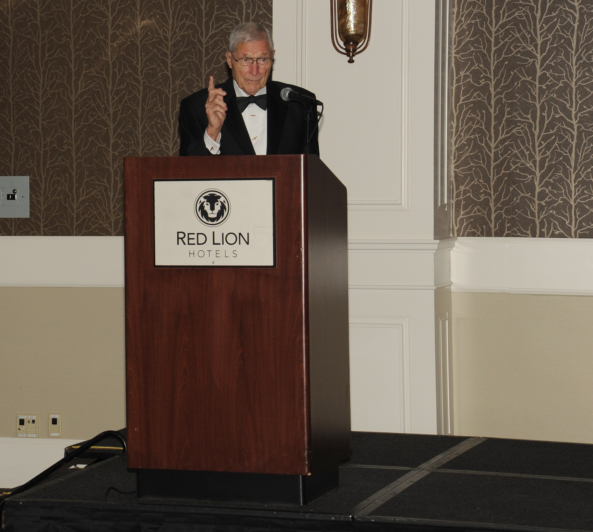 Air Force Ball guest speaker, Capt. (Ret) Richard Taylor, the first boom operator, talks during the celebration to commemorate the 67th anniversary of the Air Force at the Red Lion Hotel in Spokane, Washington, Sept. 6, 2014. The ball is an annual Air Force-wide tradition to celebrate the heritage and history of the Air Force. (U.S. Air Force photo by Staff Sgt. Samantha Krolikowski/Released)