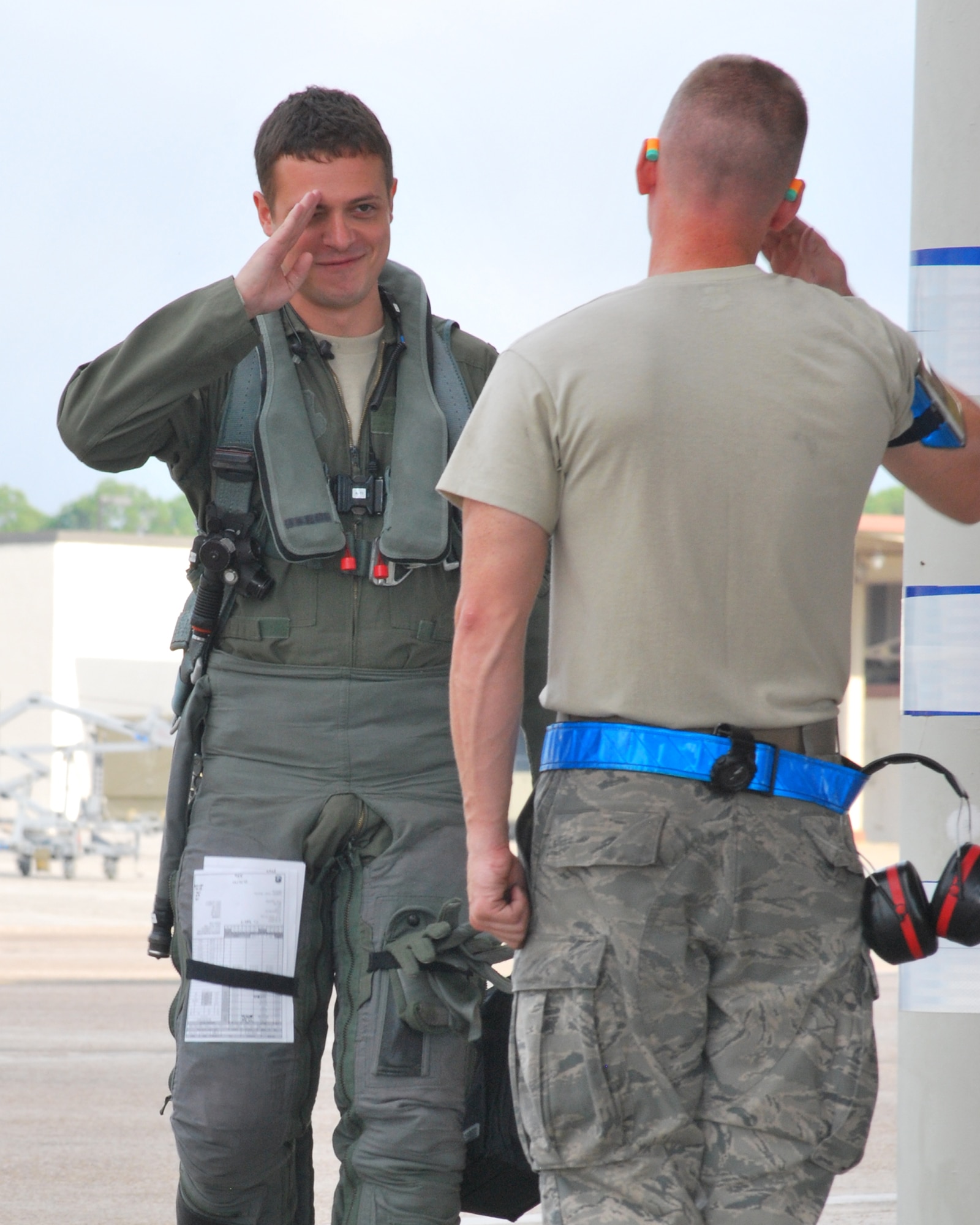 First Lt. Brenden Torphy, 95th Fighter Squadron pilot, receives a salute as
he prepares to board his jet for a flying mission Sept. 8 at Tyndall. (U.S. Air Force photo by 2nd Lt. Christopher Bowyer-Meeder)