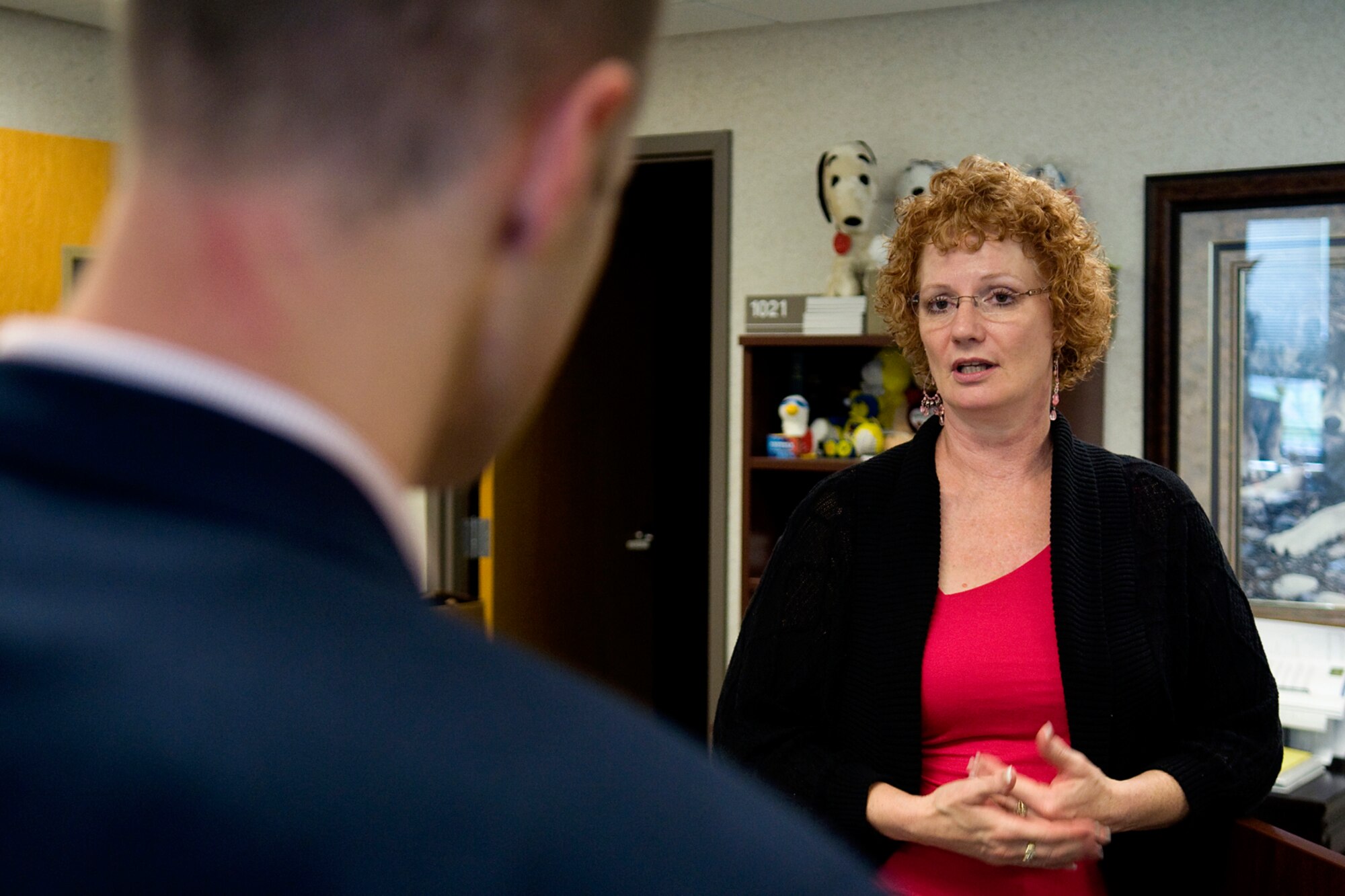 Jill Marconi, Grissom Airman and Family Readiness director, talks with Sam Fletcher, military legislative assistant for Rep. Jackie Walorski, about family readiness and sexual assault prevention programs at Grissom Air Reserve Base, Ind., Aug. 27, 2014. Fletcher visited the base to learn more about the 434th Air Refueling Wing and its mission. (U.S. Air Force photo/Tech. Sgt. Mark R. W. Orders-Woempner) 

