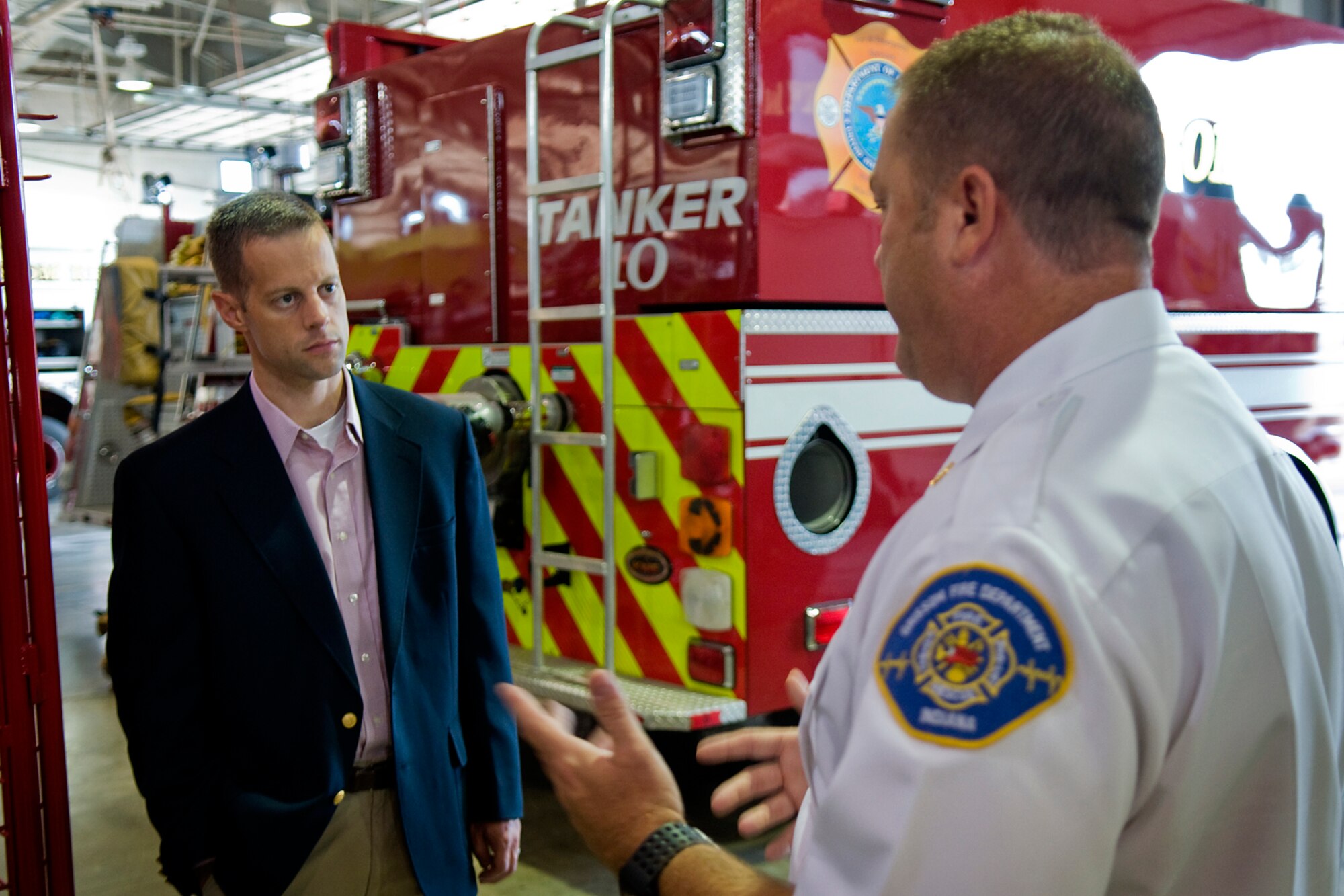 John Ireland, Grissom Fire Department fire chief, talks about Grissom's fire and rescue response capabilities with Sam Fletcher, military legislative assistant for Rep. Jackie Walorski, at Grissom Air Reserve Base, Ind., Aug. 27, 2014. Fletcher visited the base to learn more about the 434th Air Refueling Wing and its mission. (U.S. Air Force photo/Tech. Sgt. Mark R. W. Orders-Woempner) 
