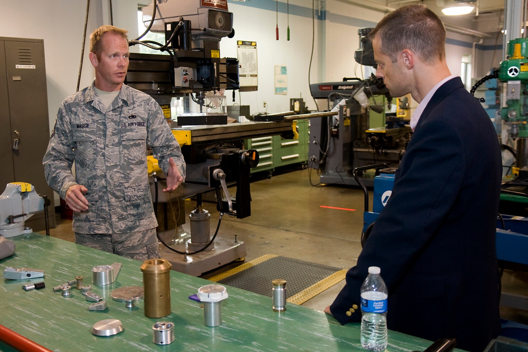 Master Sgt. James Massie, 434th Maintenance Squadron metals technology noncommissioned officer in charge, Tech. Sgt. Benjamin Bond, 434th Aircraft Maintenance Squadron crew chief, shares information about a KC-135R Stratotanker with Sam Fletcher, military legislative assistant for Rep. Jackie Walorski, Grissom Air Reserve Base, Ind., Aug. 27, 2014. Fletcher made several remarks during the trip about how well Grissom's KC-135s were maintained. (U.S. Air Force photo/Tech. Sgt. Mark R. W. Orders-Woempner) 
