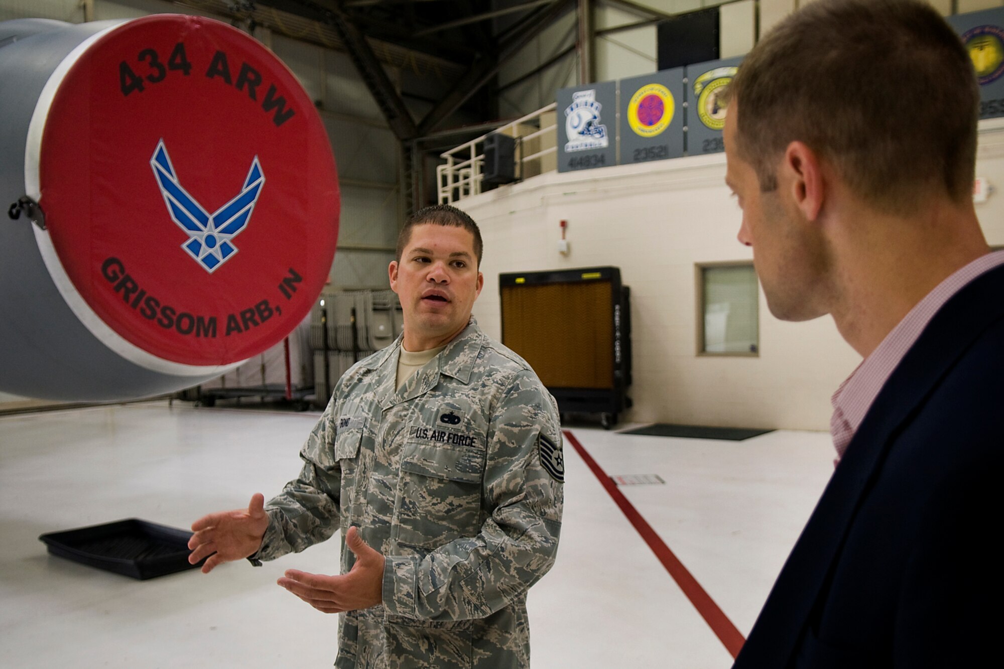 Tech. Sgt. Benjamin Bond, 434th Aircraft Maintenance Squadron crew chief, shares information about a KC-135R Stratotanker with Sam Fletcher, military legislative assistant for Rep. Jackie Walorski, Grissom Air Reserve Base, Ind., Aug. 27, 2014. Fletcher made several remarks during the trip about how well Grissom's KC-135s were maintained. (U.S. Air Force photo/Tech. Sgt. Mark R. W. Orders-Woempner) 
