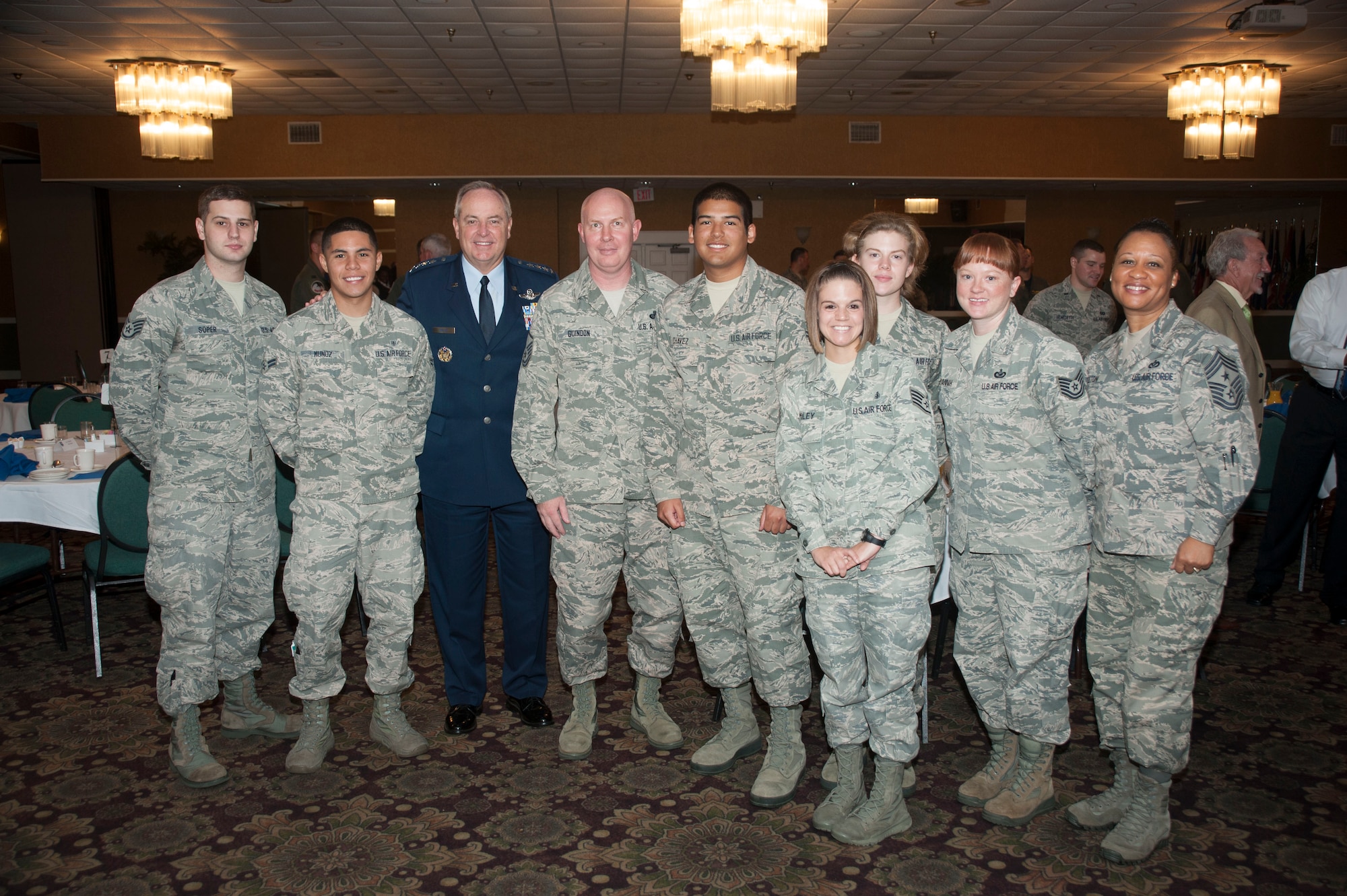 Gen. Mark A. Welsh III, Chief of Staff of the Air Force, poses with Command Chief Master Sergeant Rita Felton, 14th Flying Training Wing, and Columbus Air Force Base enlisted members after Specialized Undergraduate Pilot Training Class 14-14's graduation breakfast Sept. 5 at Columbus Air Force Base, Miss. Welsh recognized the enlisted members for their contributions to Columbus AFB's mission of Producing Pilots, Advancing Airmen, and Feeding the Fight. (U.S. Air Force Photo/Airman John Day)
