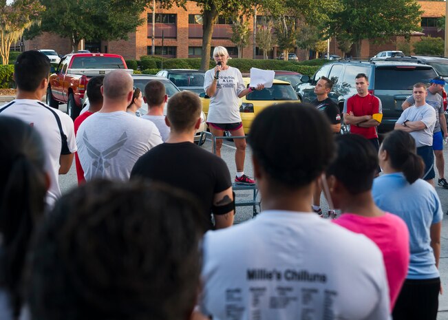 Gail Meminger Rush speaks before a Run for A Life 5K Sept. 5, 2014, at Joint Base Charleston S.C. Rush lost her daughter to suicide in Jan. 3, 2012. She spoke on topics of resiliency and suicide awareness. (U.S. Air Force photo/Staff Sgt. William O'Brien)