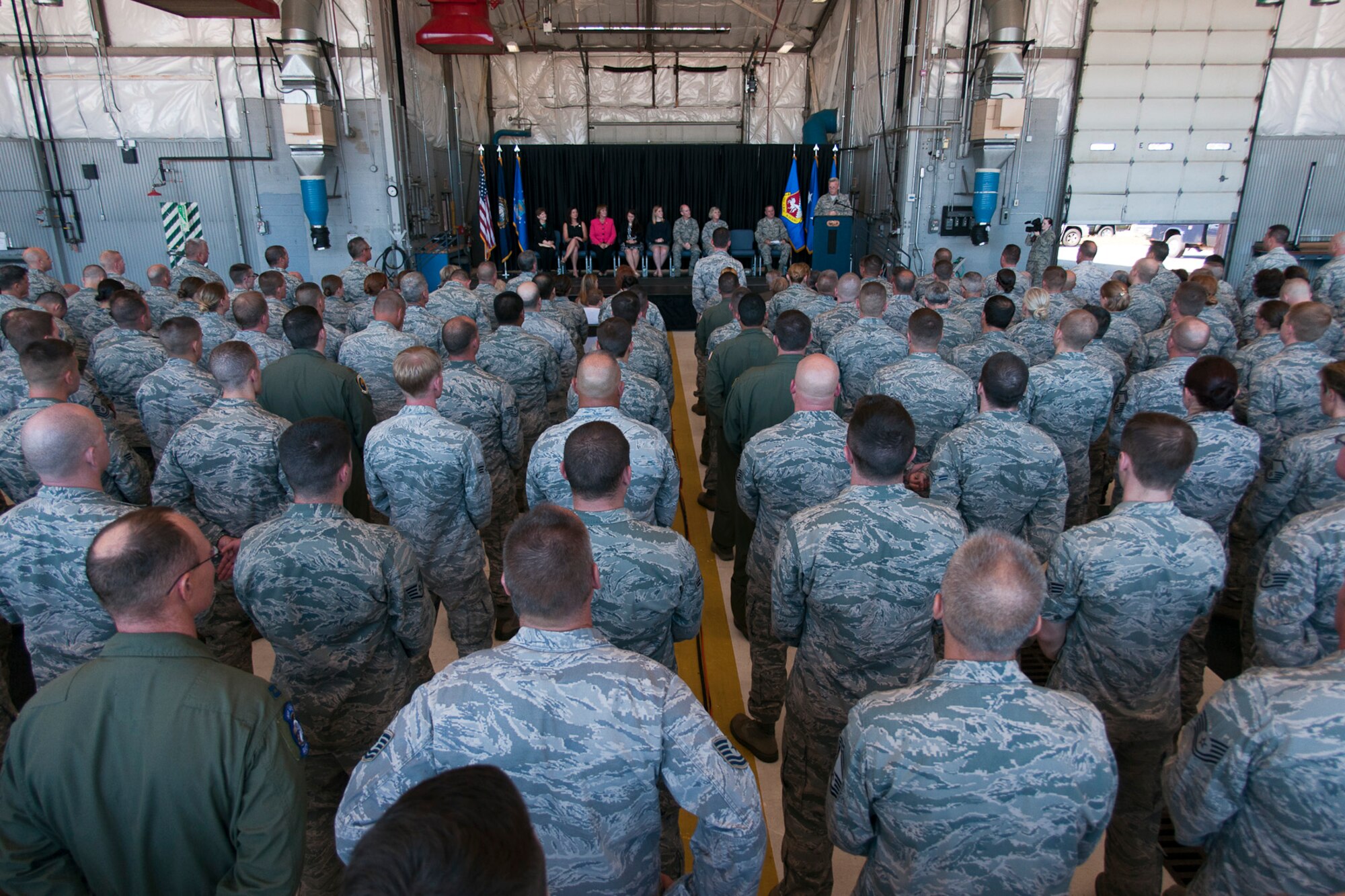 U.S. Airmen with the 157th Air Refueling Wing, New Hampshire Air National Guard, and members of the New Hampshire congressional delegation gather to celebrate Pease Air National Guard Base being selected as the home of the new KC-46A air refueling tanker, Sept. 7, 2014. (Air National Guard photo by Tech. Sgt. Aaron Vezeau/Released) 