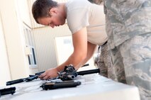 Senior Airman Joseph Stover, 791st Missile Security Forces Squadron convoy response force member, assembles an M4 rifle on Minot Air Force Base, N.D., Sept. 4, 2014. Stover is a member of the 91st Security Forces Group Global Strike Challenge team. (U.S. Air Force photo/Senior Airman Brittany Y. Bateman)