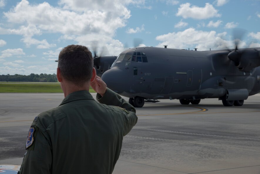 U.S. Air Force Col. Chad Franks, 23d Wing commander, salutes as Maj. Gen. H.D. Polumbo Jr., 9th Air Force commander, arrives in a C-130J Hercules Sept. 4, 2014, at Moody Air Force Base, Ga. The general visited the base for a base tour and to meet Airmen from different units of the base. (U.S. Air Force photo by Staff Sgt. Eric Summers Jr.)