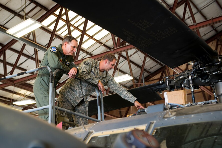 Tech. Sgt. Scott Dickover, 723rd Aircraft Maintenance Unit, explains HH-60G Pave Hawk critical maintenance procedures to Maj. Gen H.D. Polumbo Jr., 9th Air Force commander, Sept. 4 at Moody Air Force Base, Ga. As part of his visit, Polumbo toured the 41st Helicopter Maintenance Unit to learn about Moody’s helicopter maintenance mission. (U.S. Air Force photo by Airman 1st Class Ryan Callaghan) 