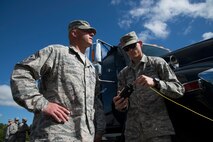 U.S. Air Force Staff Sgt. Steven Segerlund, right, 23d Civil Engineer Squadron explosive ordnance disposal flight, explains the flights capabilities to Chief Master Sgt. Scott Fuller, 9th Air Force command chief, Sept. 4, 2014, at Moody Air Force Base, Ga. The Chief visited several units around the base including security forces, maintenance and rescue squadrons. (U.S. Air Force photo by Staff Sgt. Eric Summers Jr. /Released)