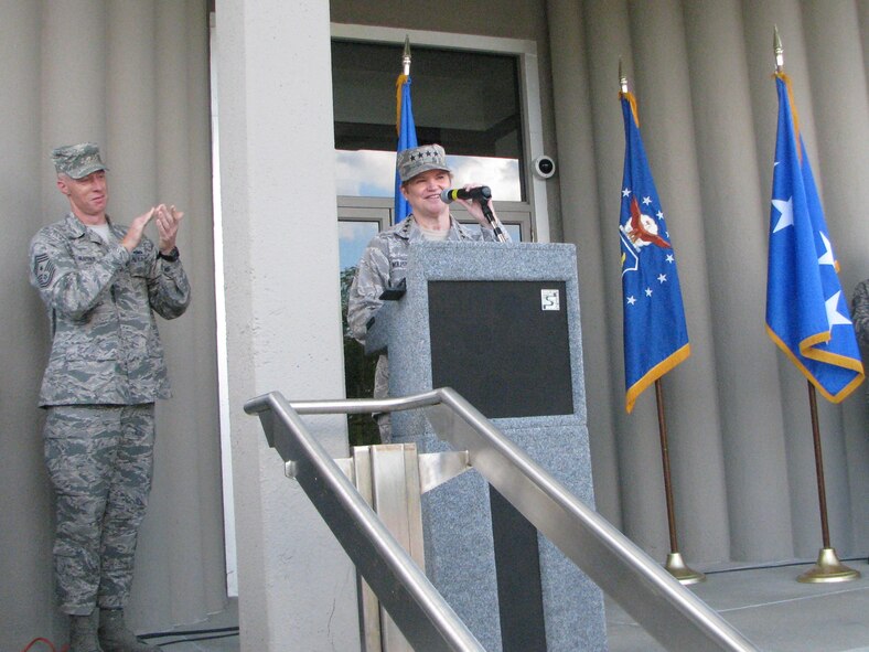 Gen. Janet Wolfenbarger, Air Force Materiel Command commander, expresses her surprise and gratitude to Chief Master Sgt. Michael Warner, AFMC command chief (left) -- and all the command's enlisted Airmen -- at being selected for induction into the Order of the Sword. (U.S. Air Force photo/JC Snediker)