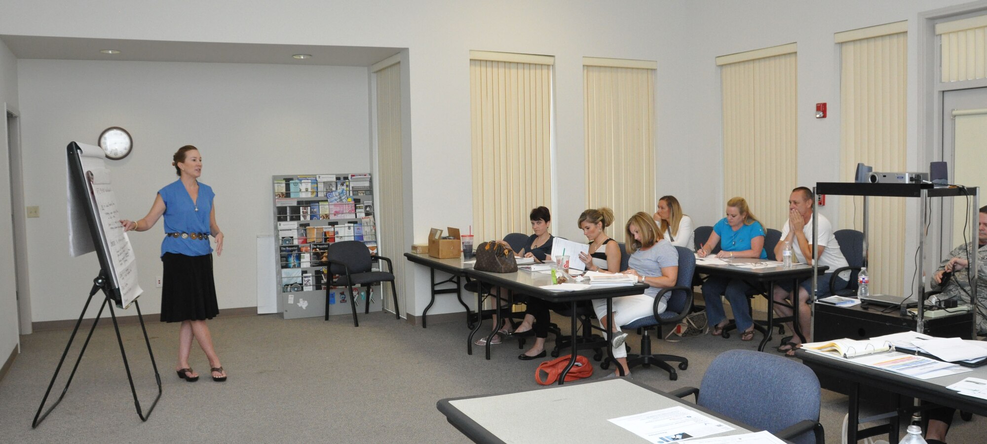 Laura Loftin, the psychological health director (DPH) for the 301st Fighter Wing, Naval Air Station Fort Worth Joint Reserve Base, Texas, provides resiliency training to 12 spouses of the wing's Key Spouse Program Sept. 7. During the training, Loftin taught key spouses how to look for depression characteristics, build resiliency, and help develop early help-seeking skills. She also provided resources, like A.C.E. – Ask, Care and Escort; to spouses should they encounter someone who needs help. (Air Force photo by Staff Sgt. Samantha Mathison)