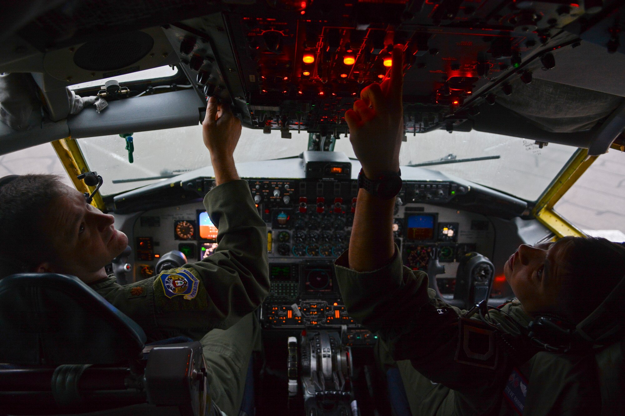 U.S. Air Force Maj. Steve Strasbaugh, left, 351st Air Refueling Squadron instructor pilot from Watonga, Okla., and U.S. Air Force Capt. Steve Briones, 351st ARS copilot from El Paso, Texas, go through their preflight checklist Sept. 5, 2014, on RAF Mildenhall, England. Before every flight, aircrew members confirm all of the aircraft’s components are functioning properly to ensure a safe flight. (U.S. Air Force photo/Senior Airman Micaiah Anthony/Released)
