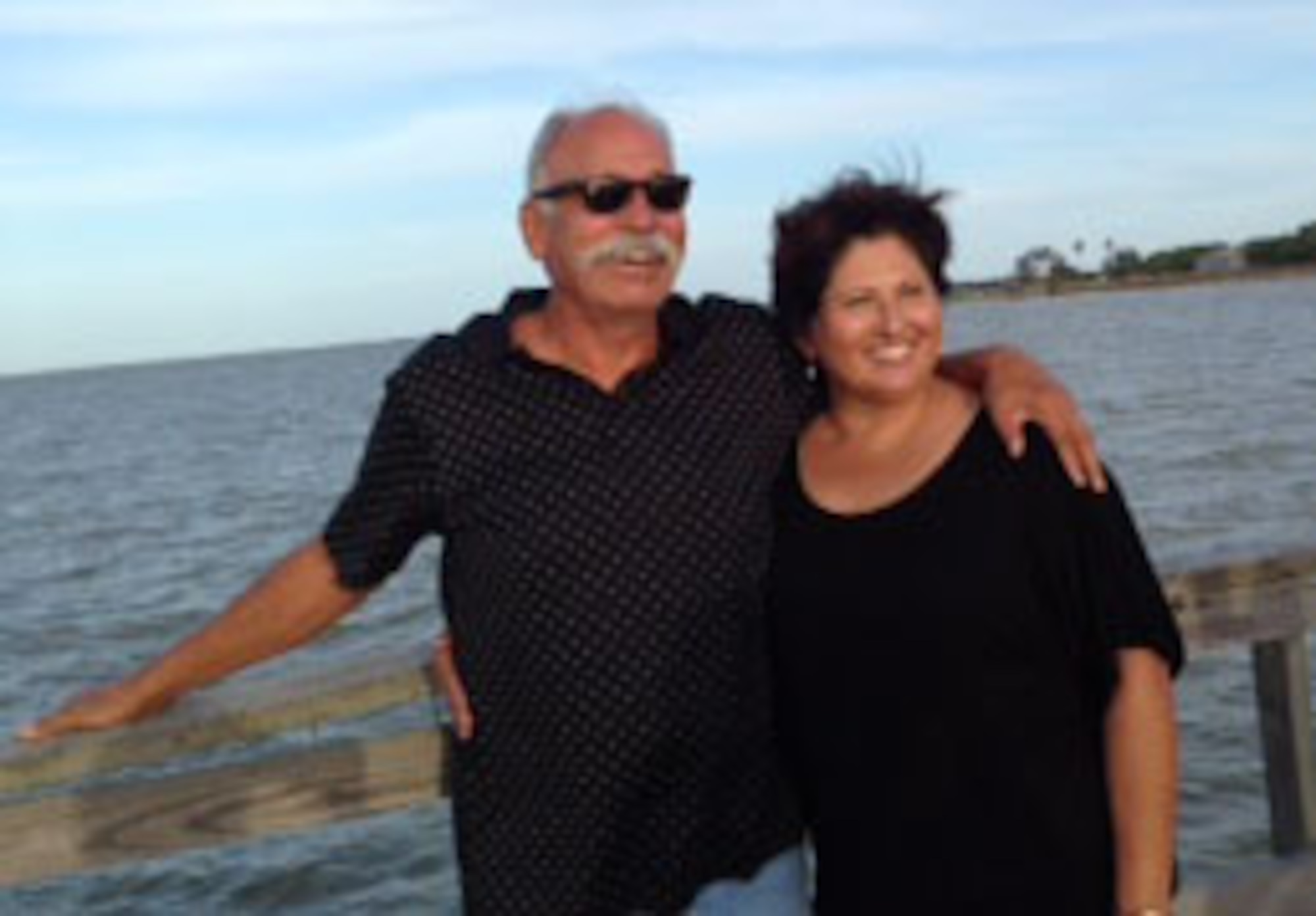 Homer and Virginia Mora pose for a photo at Baffin Bay, Texas, July 5, 2014. San Antonio Military Medical Center surgeons reconnected Mora’s thumb after a table saw accident. (Courtesy photo)
