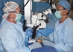 Lt. Col. (Dr.) Joseph Gower (left) and Maj. (Dr.) Peter Rhee perform microvascular surgery on a patient at the San Antonio Military Medical Center in August 2014. Earlier this year, Gower and Rhee launched a microvascular surgery program at SAMMC that now serves military and civilian trauma patients throughout the region. (U.S. Army photo/Dwayne Snader)