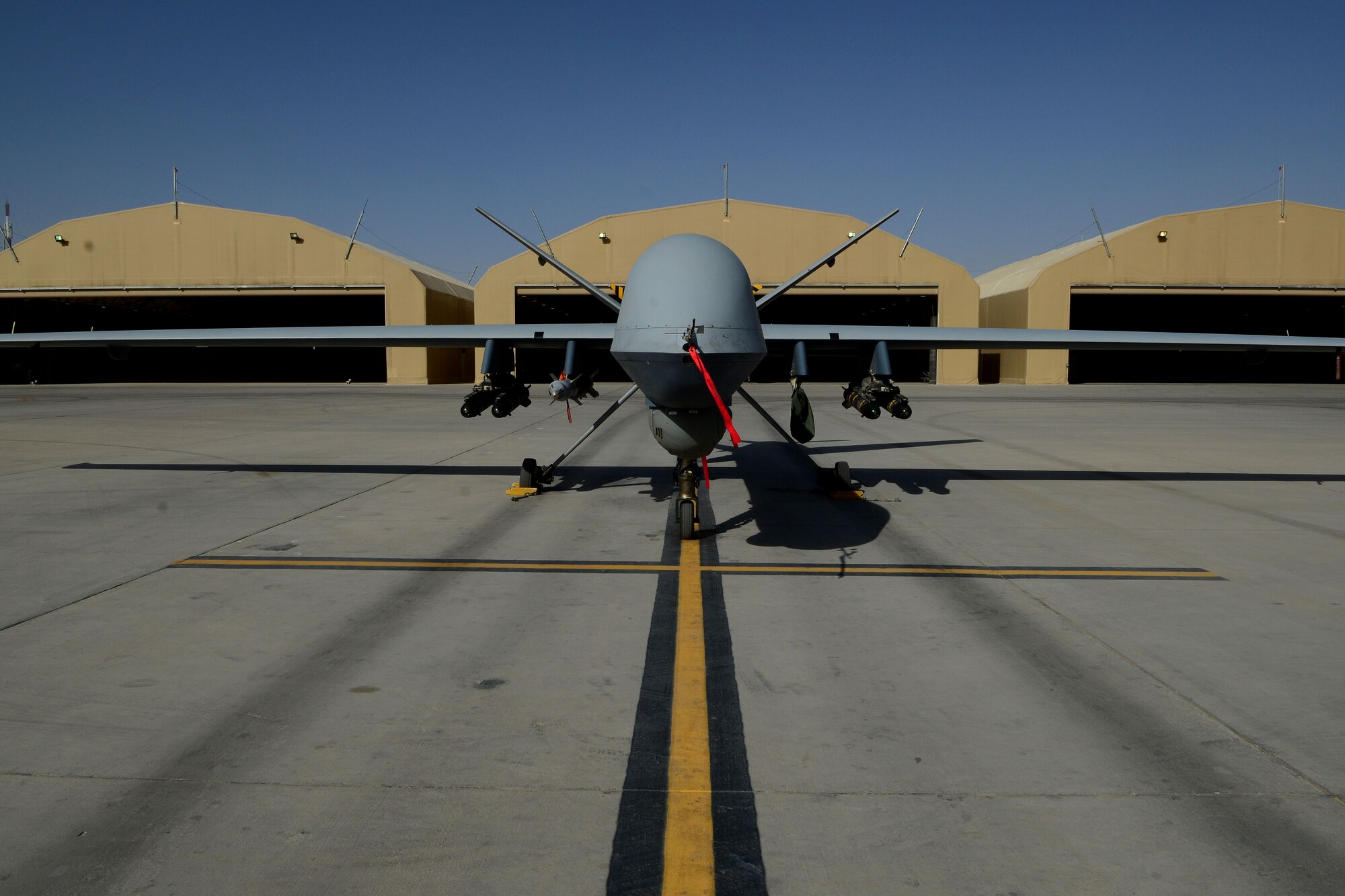An MQ-9 Reaper with the 62nd Expeditionary Reconnaissance Squadron sits on a ramp at Kandahar Airfield, Afghanistan Aug. 18, 2014.  The Reaper is launched, recovered and maintained here. It is also remotely piloted by pilots in bases located in the U.S. (U.S. Air Force photo by Staff Sgt. Evelyn Chavez/Released)