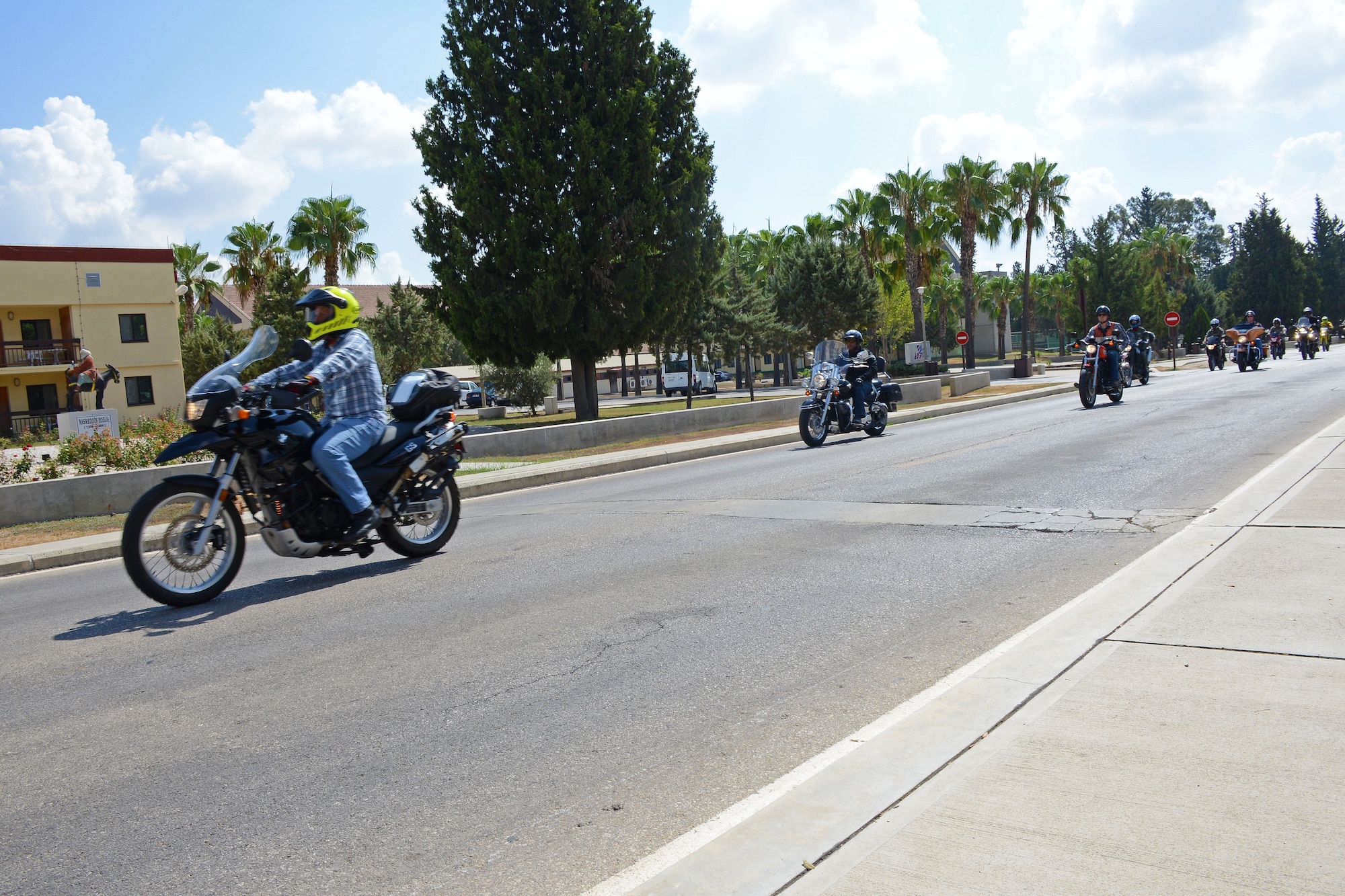 A group of Turkish and American Airmen ride past the Hodja Inn Sept. 5, 2014, Incirlik Air Base, Turkey. The motorcycle riders participated in a joint motorcycle safety course provided by the 39th Air Base Wing safety office. (U.S. Air Force photo by Staff Sgt. Veronica Pierce/Released)