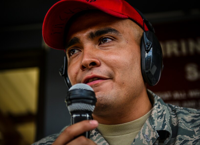 Senior Airman Enrique Salas, 39th Security Forces Squadron combat arms training and maintenance instructor, gives commands during the firing portion of a combat arms class Sept. 4, 2014, Incirlik Air Base, Turkey.  Combat arms instructors teach weapons qualifications for situations such as permanent change of station, deployments and to keep Airmen fresh in their weapons skills.  (U.S. Air Force photo by Senior Airman Nicole Sikorski/Released)