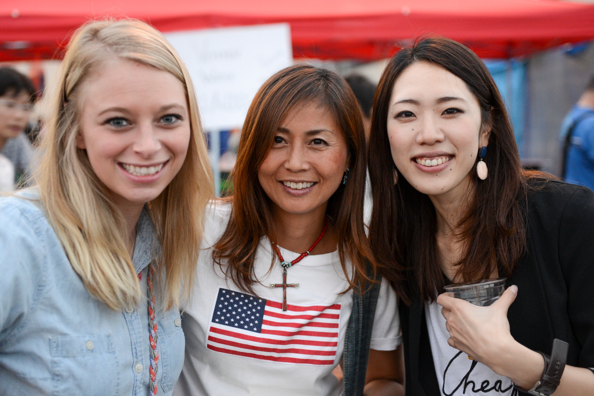 Friends pose for a photo together during the 2014 Japanese-American Friendship Festival at Yokota Air Base, Japan, Sept. 7, 2014. More than 148,000 people attended this year’s festival. (U.S. Air Force photo by Staff Sgt. Cody H. Ramirez/Released)