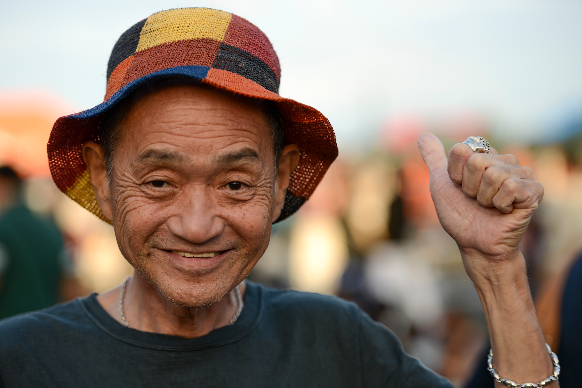 A man gives a 'thumbs-up' to show his excitement during the 2014 Japanese American Friendship Festival at Yokota Air Base, Japan, Sept. 7, 2014. During the two-day festival, Yokota hosted more than 148,000 attendees. The festival featured a variety of U.S. and Japanese military aircraft and offered an array of food booths and multicultural entertainment. (U.S. Air Force photo by Staff Sgt. Cody H. Ramirez/Released)