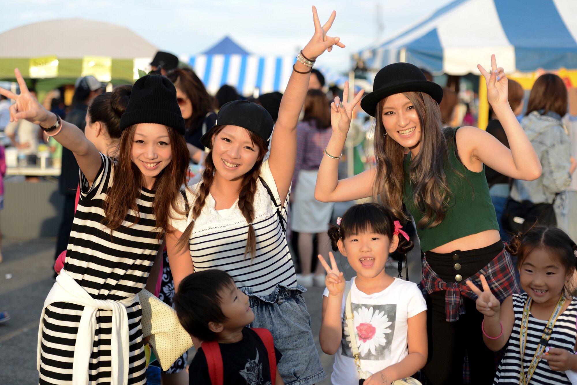Festival goers poses for a picture during the 2014 Japanese-American Friendship Festival at Yokota Air Base, Japan, Sept. 7, 2014. More than 148,000 people attended this year’s festival. (U.S. Air Force photo by Staff Sgt. Cody H. Ramirez/Released)