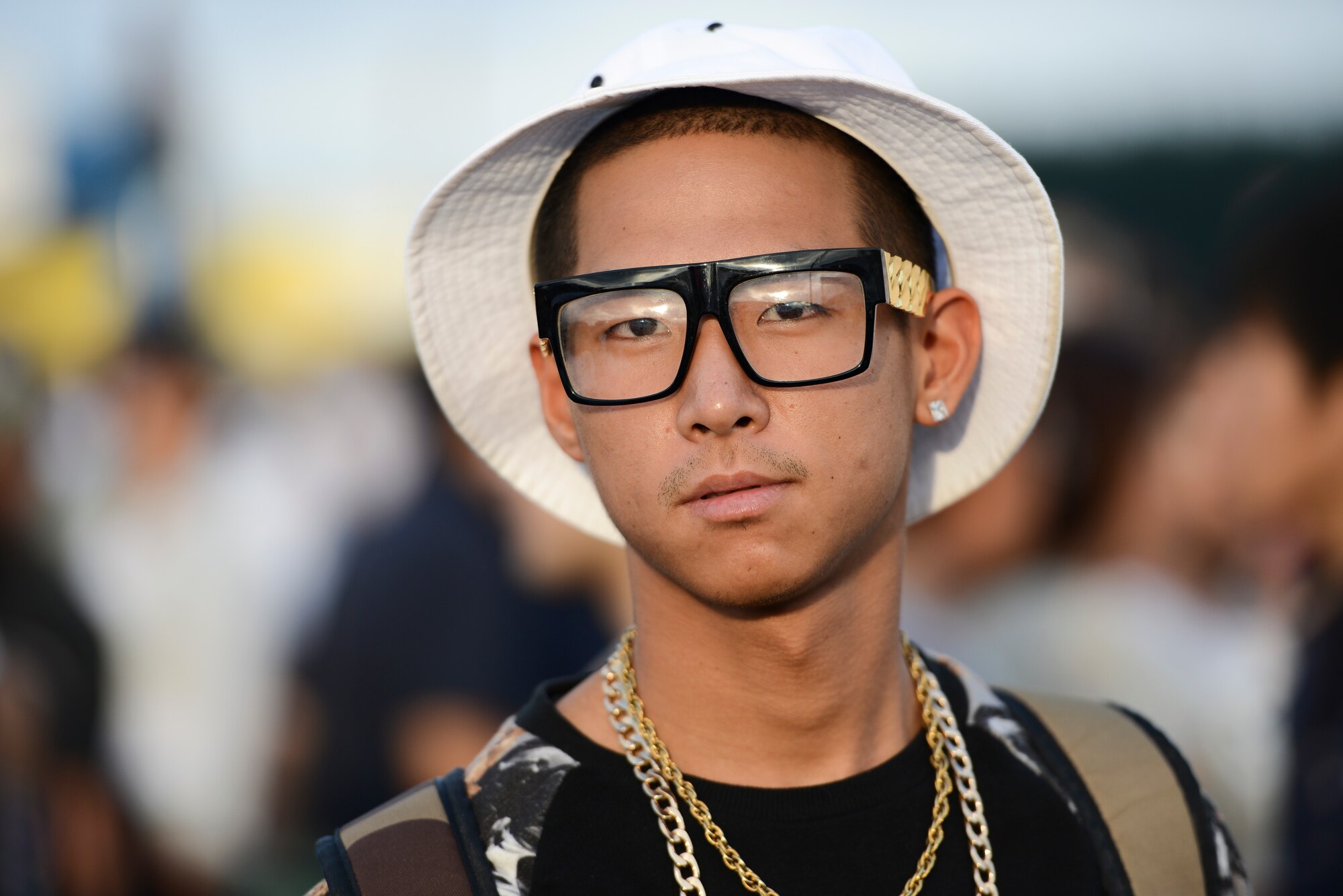 A man stands in a crowd during the 2014 Japanese-American Friendship Festival at Yokota Air Base, Japan, Sept. 7, 2014. More than 148,000 people attended this year’s festival, which featured a variety of U.S. and Japanese military aircraft and offered an array of food booths and live entertainment. (U.S. Air Force photo by Staff Sgt. Cody H. Ramirez/Released)