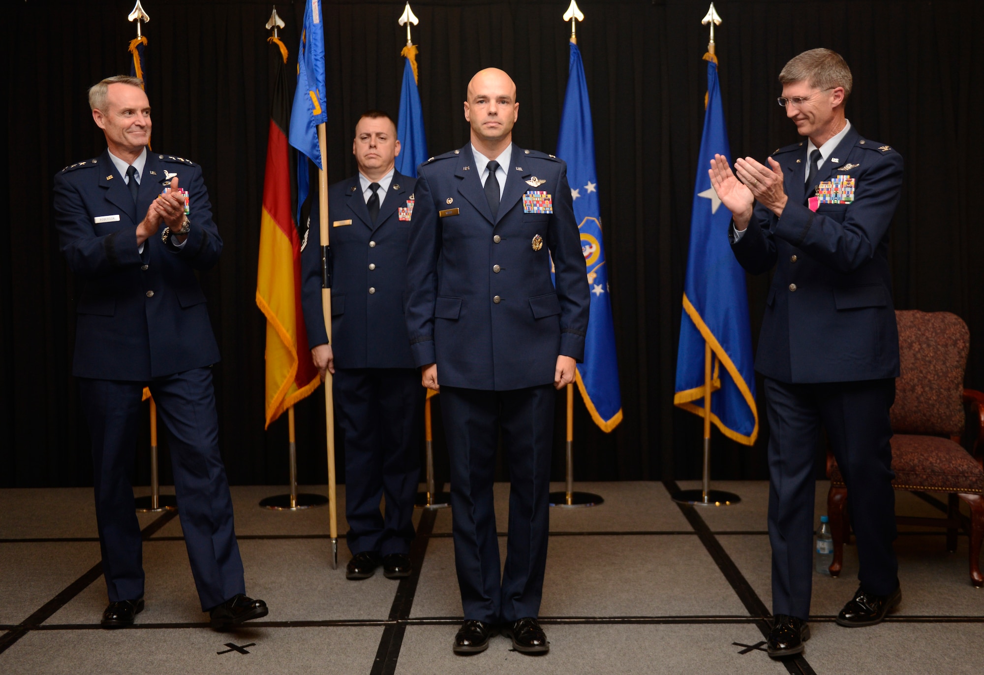 Lt. Gen. Darryl Roberson, 3rd Air Force commander, and Col. Jeff Marker, outgoing 603rd AOC commander, congratulate Col. Michael Webb, 603rd AOC commander, during a change of command ceremony Sept. 4, 2014. Webb was previously assigned to U.S. Special Operations Command as a strategic planner. Marker will retire with his wife in Boise, Idaho after 27 years of service. (U.S. Air Force photo/ Staff Sgt. Ryan Crane)