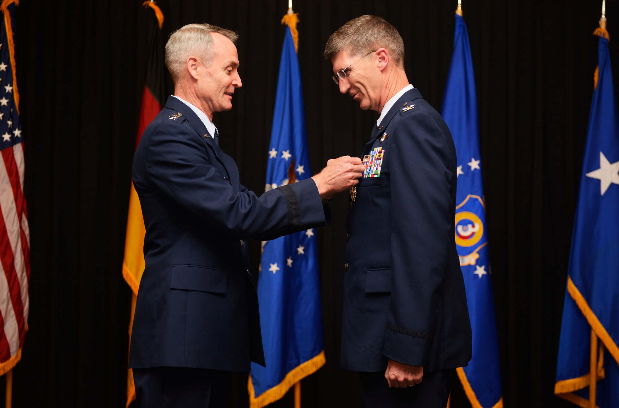 Lt. Gen. Darryl Roberson, 3rd Air Force commander, pins a Legion of Merit decoration on Col. Jeff Marker, 603rd Air and Space Operations Center outgoing commander,during a change of command ceremony Sept. 4, 2014. The incoming commander, Col. Michael Webb was previously assigned to U.S. Special Operations Command as a strategic planner. Marker will retire with his wife to live in Boise, Idaho after 27 years of service. (U.S. Air Force photo by Staff Sgt. Ryan Crane)