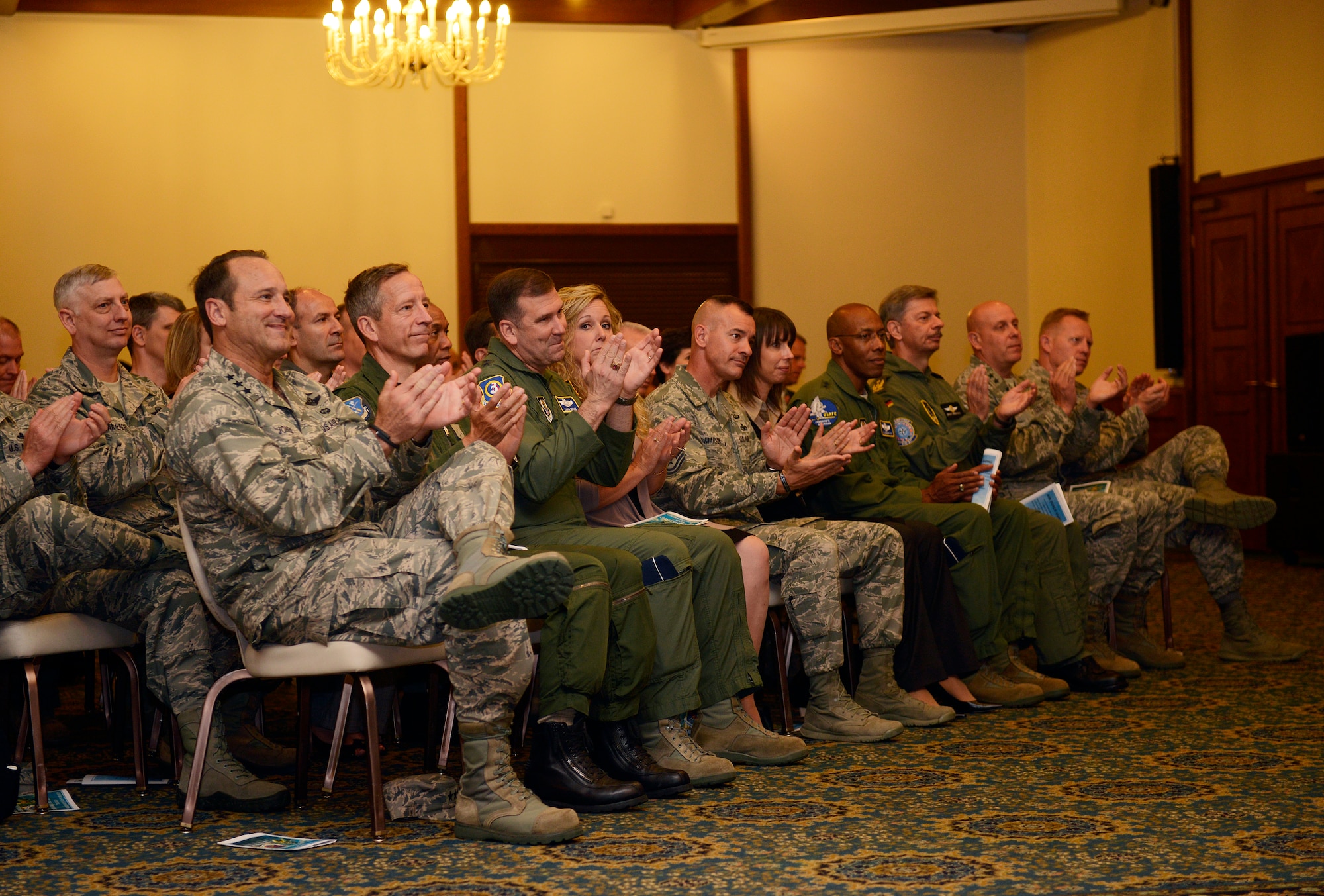 Senior leaders from Ramstein Air Base, Germany, applaud for Col. Jeff Marker, 603rd Air and Space Operations Center outgoing commander, after he was awarded a Legion of Merit during a change of command ceremony Sept. 4, 2014. The incoming commander, Col. Michael Webb was previously assigned to U.S. Special Operations Command as a strategic planner. Marker will retire with his wife to live in Boise, Idaho after 27 years of service. (U.S. Air Force photo by Staff Sgt. Ryan Crane)
