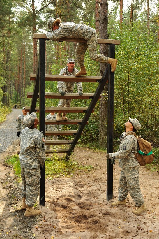U.S. soldiers conduct obstacle course training at the Multinational Training Command's Grafenwoehr Training Area, Germany, Sept. 4, 2014.